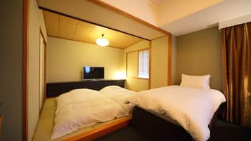 Suite Tradition, non-fumeurs | Coffres-forts dans les chambres, bureau, rideaux occultants