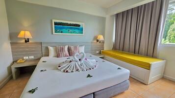Superior Family Room | 1 bedroom, free minibar items, in-room safe, individually decorated