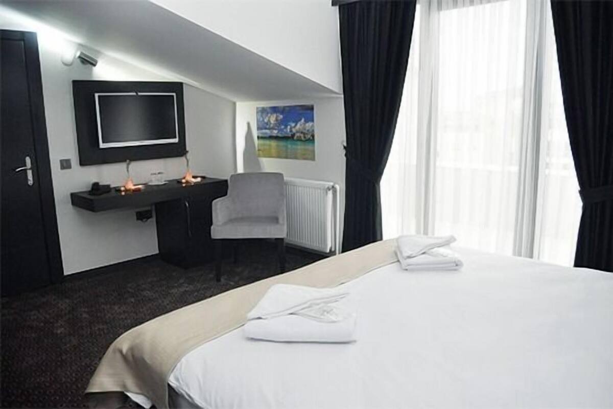 Suite | Minibar, coffres-forts dans les chambres, bureau, Wi-Fi gratuit