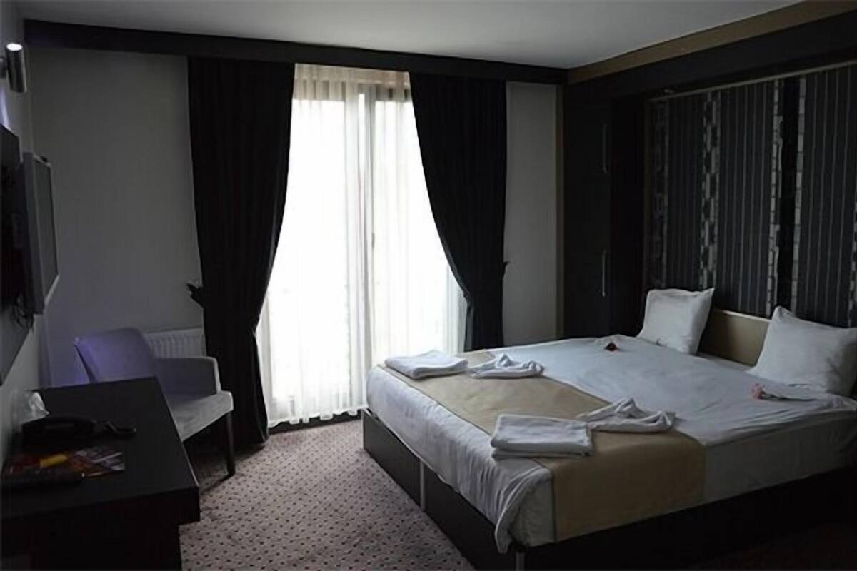 Chambre Simple | Minibar, coffres-forts dans les chambres, bureau, Wi-Fi gratuit
