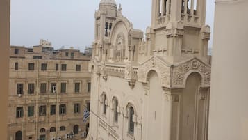 A historic building with ornate architecture, including a bell tower and detailed carvings.