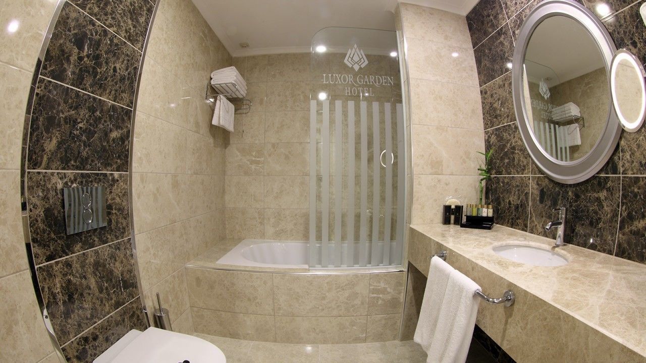deluxe room | bathroom | free toiletries, hair dryer, slippers, towels