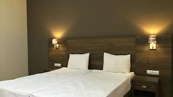 Standard Double Room | Minibar, in-room safe, desk, blackout curtains
