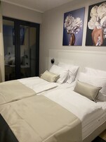 Apartment, 2 Bedrooms, Sea View | Minibar, desk, cribs/infant beds, free WiFi