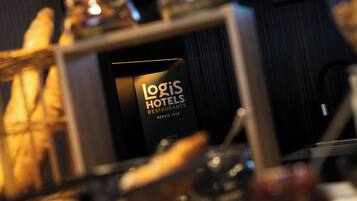 A sign for Loris Hotels Restaurants with a vintage design, indicating a long-standing establishment since 1948.