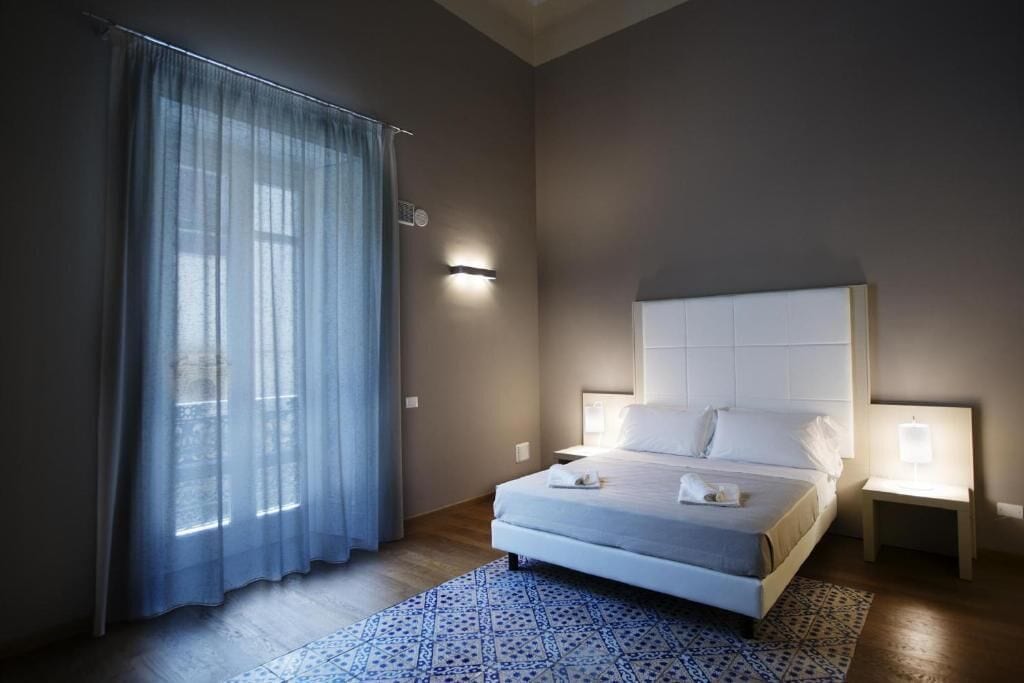 deluxe studio | premium bedding, desk, laptop workspace, soundproofing