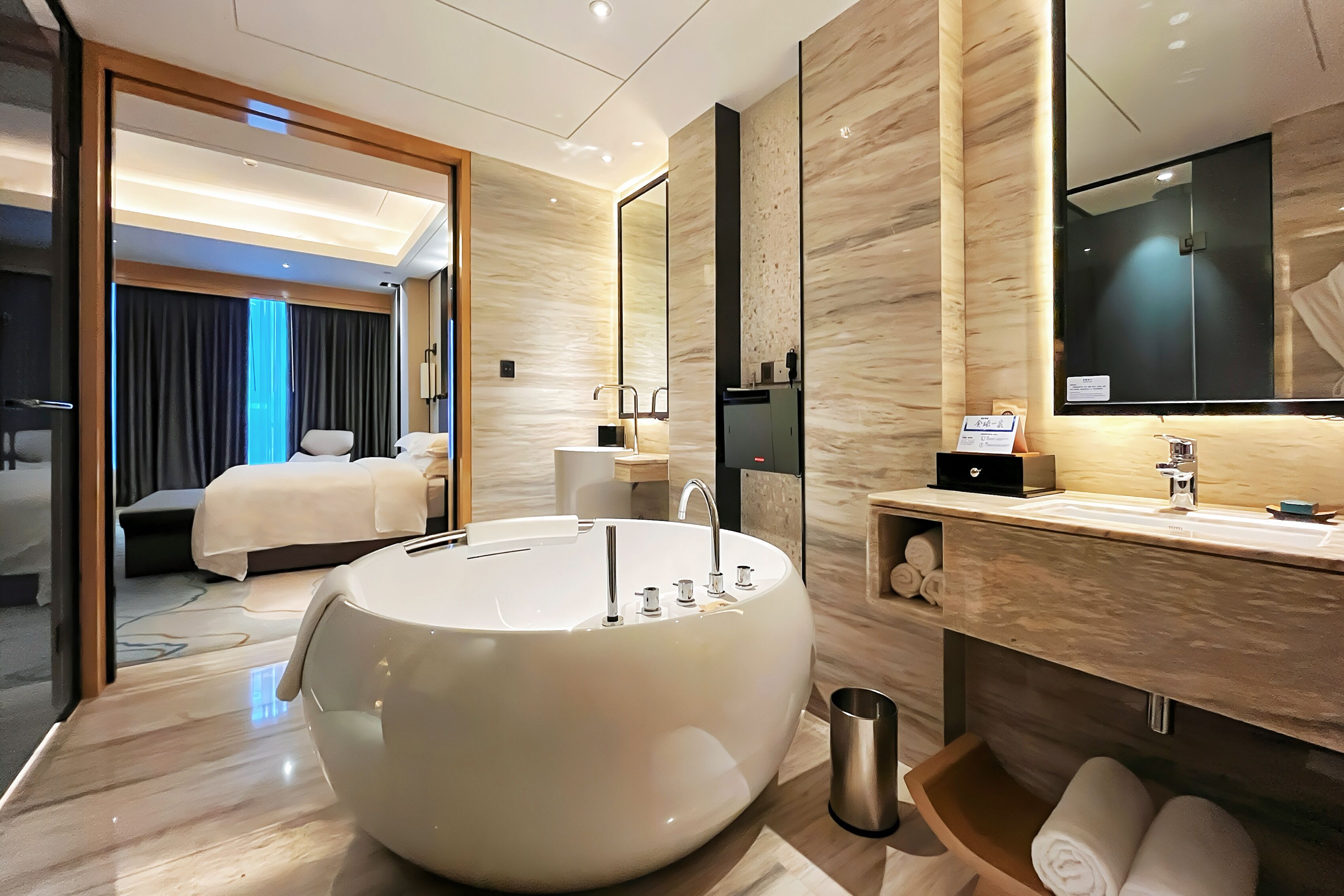 king deluxe suite | bathroom | separate bathtub and shower, rainfall showerhead, designer toiletries