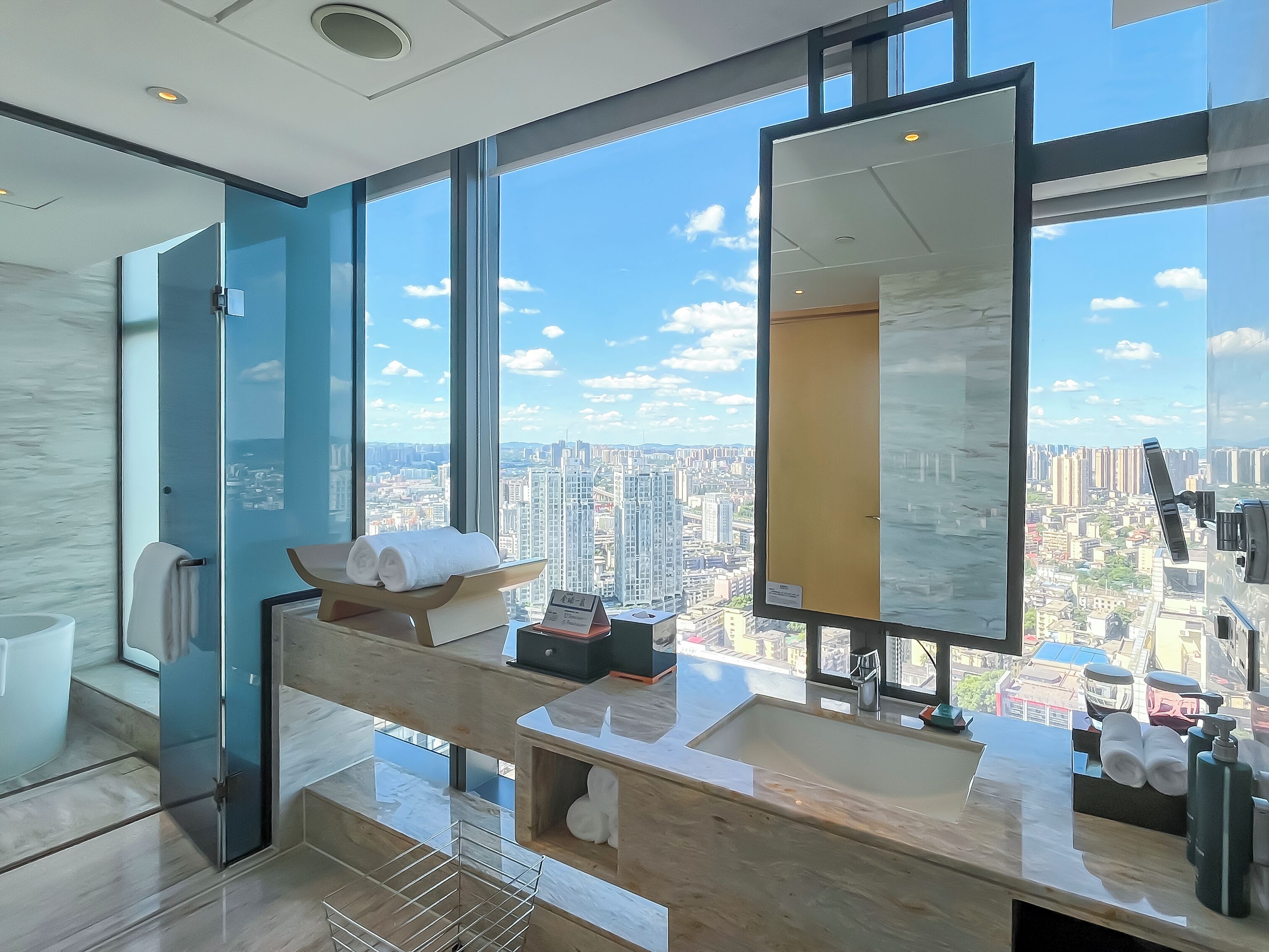 king premium studio river view | bathroom | separate bathtub and shower, rainfall showerhead, designer toiletries