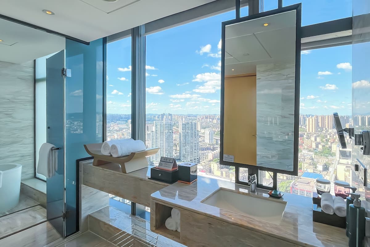 king premium studio river view | bathroom | separate bathtub and shower, rainfall showerhead, designer toiletries