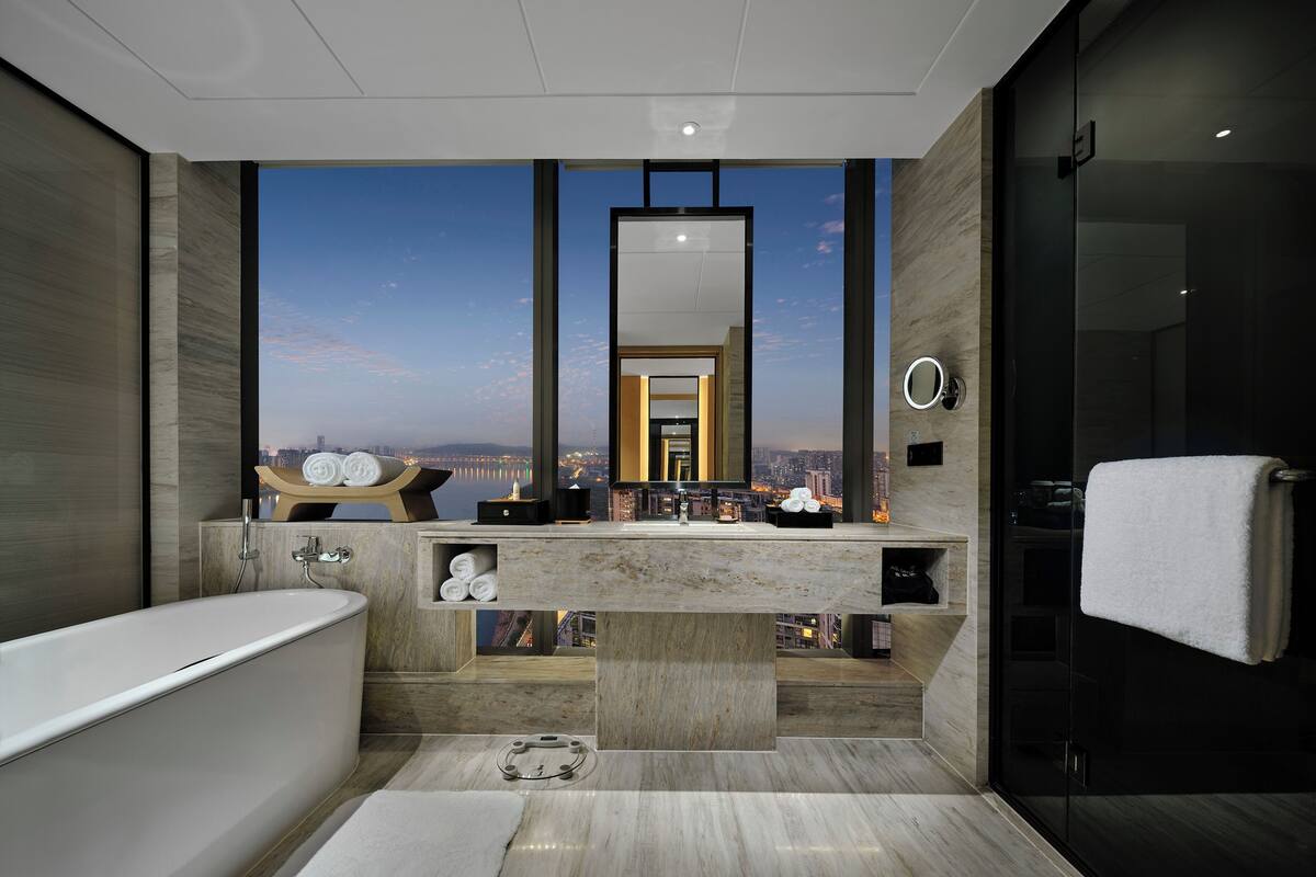 king premium room panorama river view | bathroom | separate bathtub and shower, rainfall showerhead, designer toiletries