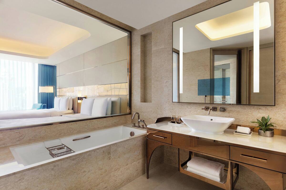 separate bathtub and shower, free toiletries, hair dryer, slippers