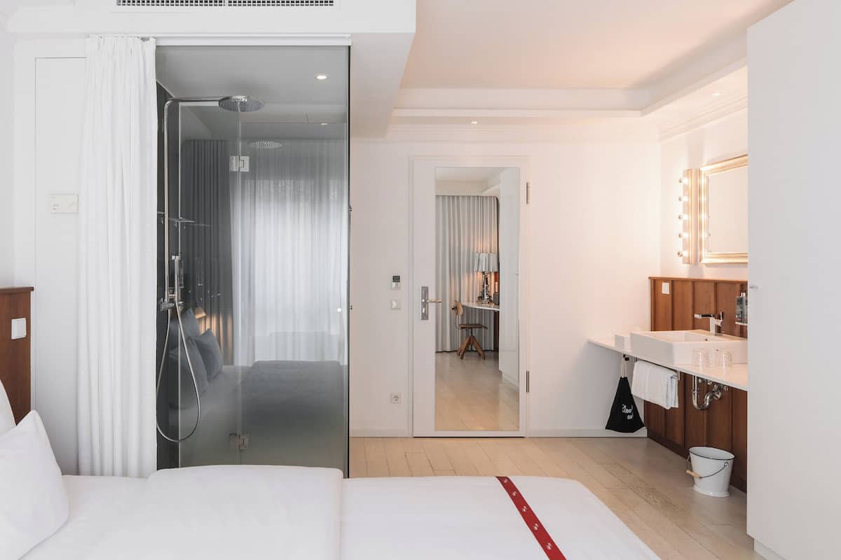 Shower, rainfall showerhead, designer toiletries, hair dryer