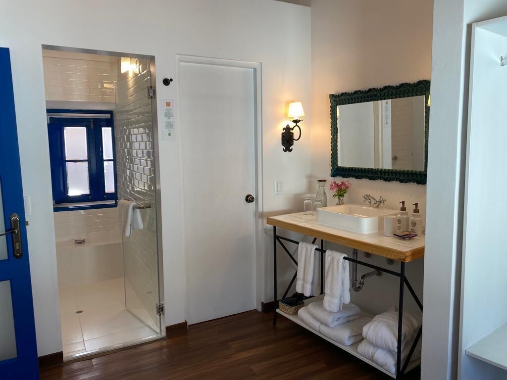 premium studio suite | bathroom | shower, designer toiletries, towels
