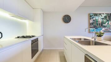 Executive Apartment, 2 Bedrooms, Lagoon View, Beachfront | Private kitchen | Full-size fridge, microwave, stovetop, dishwasher