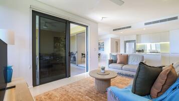 Executive Apartment, 2 Bedrooms, Lagoon View, Beachfront | Living area | Flat-screen TV