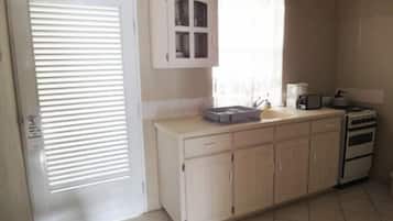 Apartment, 1 Bedroom | Private kitchenette | Fridge, stovetop, coffee/tea maker