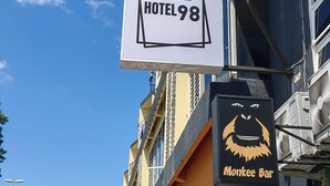 A hotel sign with a grid of colored squares and the text "HOTEL98". - Hotel 98 (Kuching)