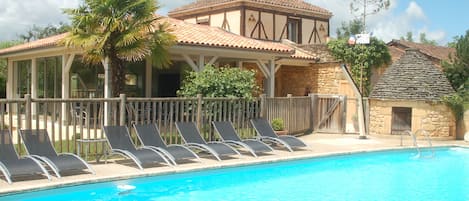 Outdoor pool, open 7:30 AM to 9:00 PM, pool umbrellas, pool loungers