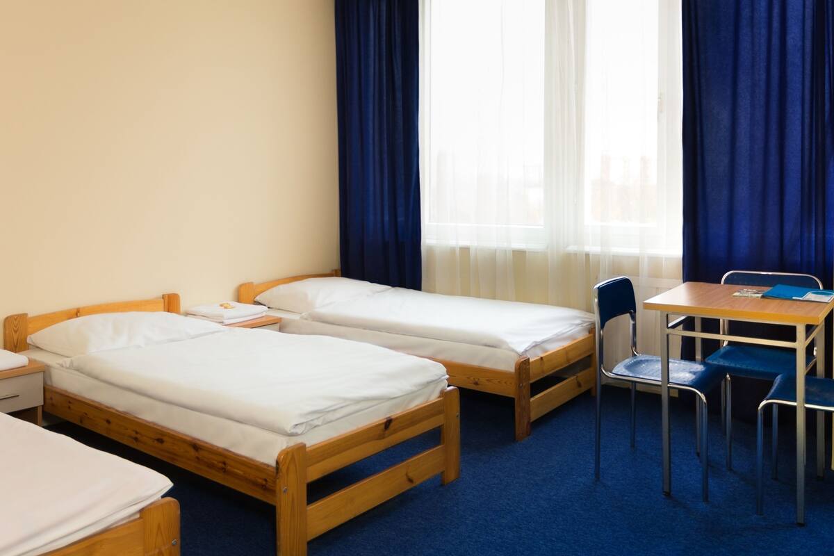Economy Triple Room, Shared Bathroom | In-room safe, WiFi (free), bed sheets
