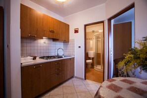 Premier Apartment, 1 Bedroom, Balcony, Ground Floor | Private kitchen | Fridge, microwave, stovetop, coffee/tea maker - Villa Mara (Rovinj)