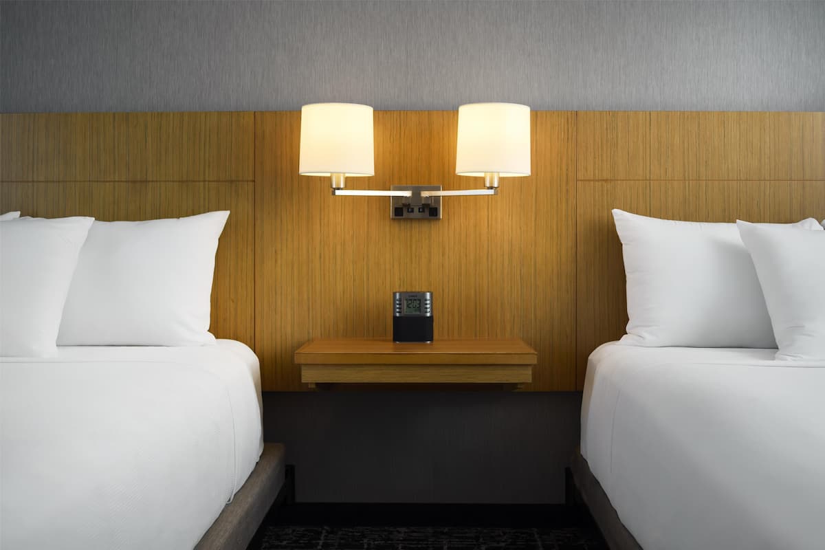 Premium bedding, down comforters, Tempur-Pedic beds, desk