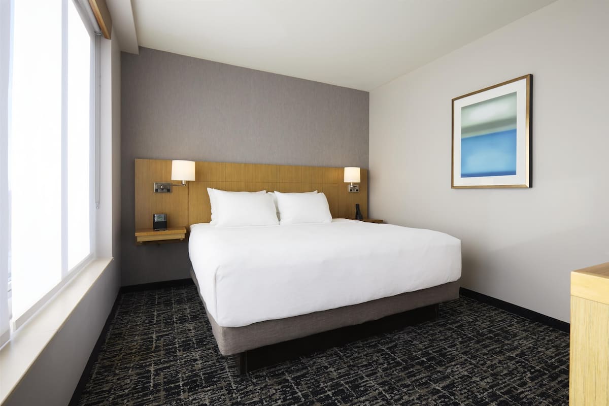 Premium bedding, down duvets, Tempur-Pedic beds, desk