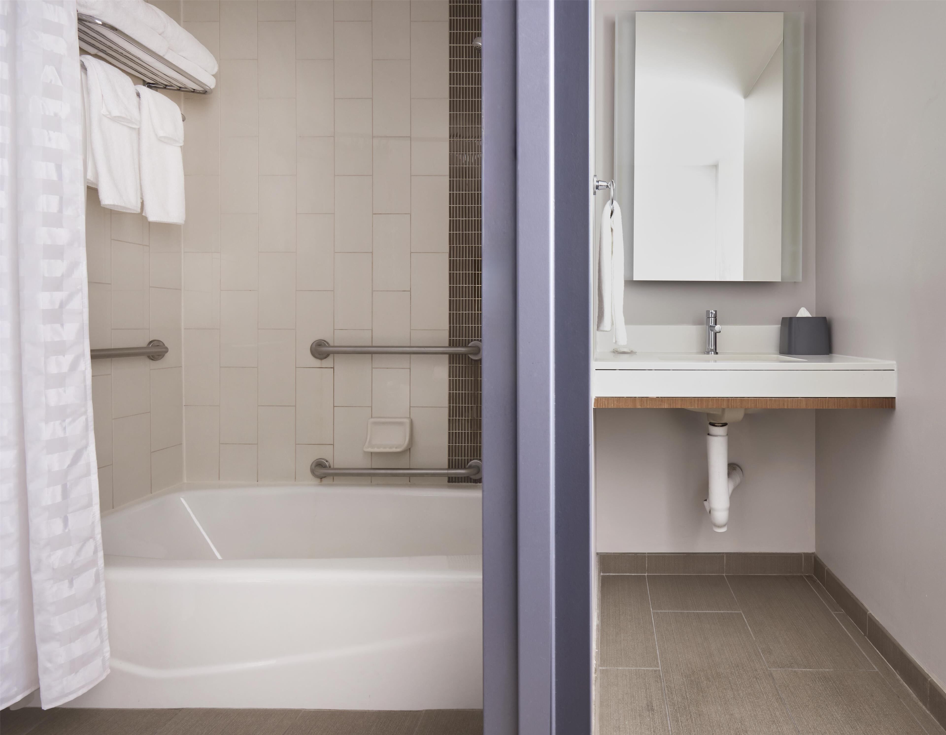 room, accessible (2 queen bed & sofabed, roll-in shower) | bathroom | free toiletries, hair dryer, towels, soap