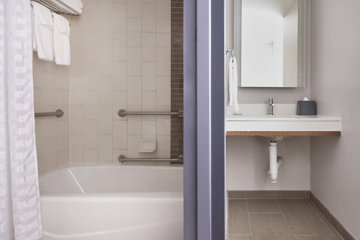 room, accessible (2 queen bed & sofabed, roll-in shower) | bathroom | free toiletries, hair dryer, towels, soap