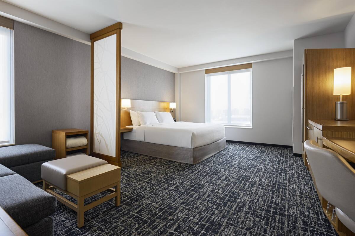 Premium bedding, down comforters, Tempur-Pedic beds, desk