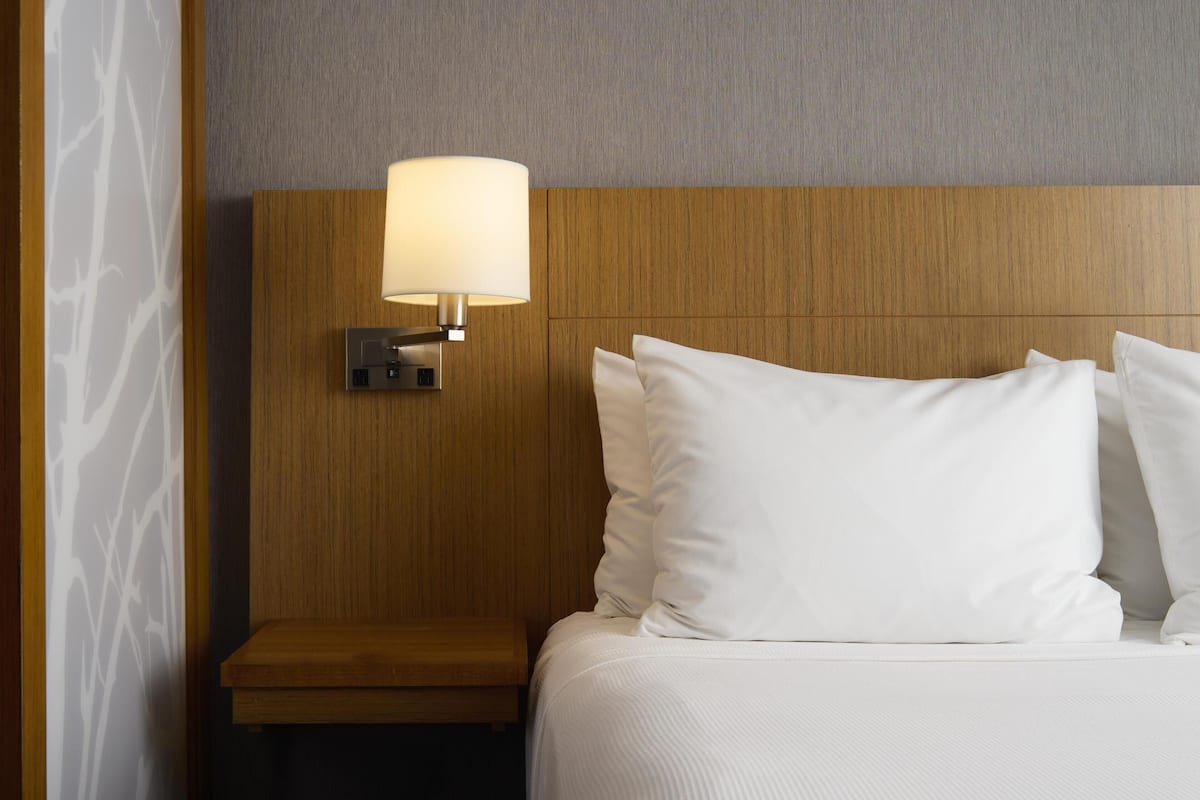 Premium bedding, down comforters, Tempur-Pedic beds, desk