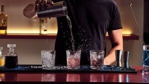 A bartender pouring a drink into a glass. - Cactus Hotel (Zakynthos)