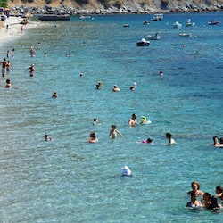 On the beach, sun loungers, beach umbrellas, fishing