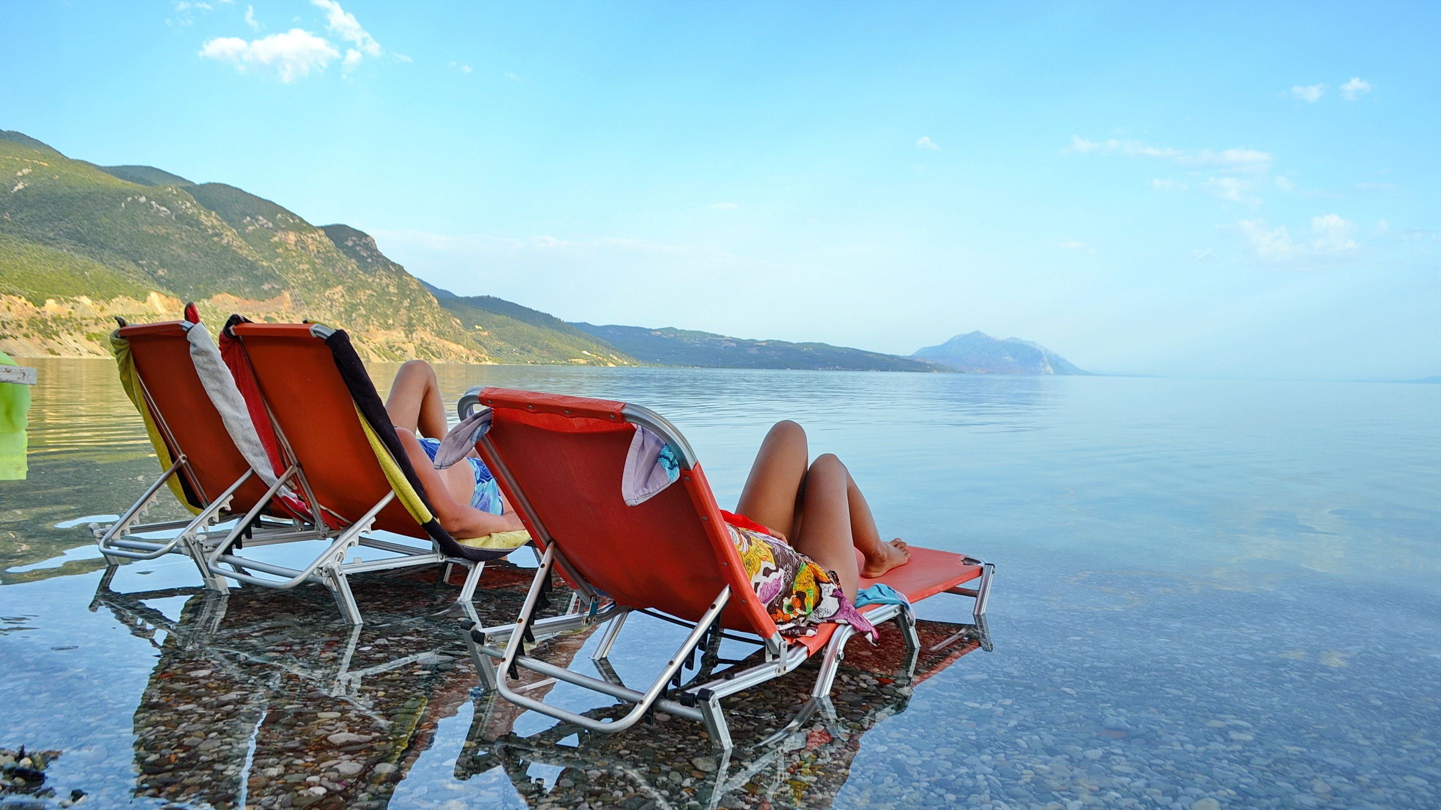 on the beach, sun-loungers, beach umbrellas, fishing
