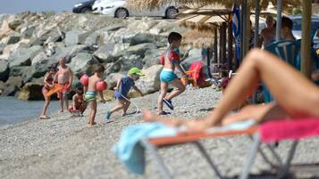 On the beach, sun loungers, beach umbrellas, fishing