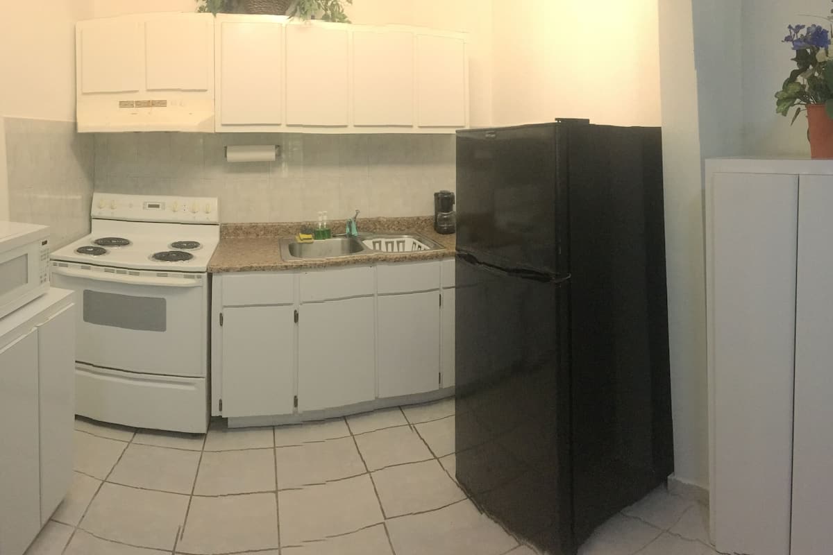 family room, 1 bedroom | private kitchen | fridge, microwave, stovetop, cookware/dishes/utensils