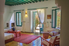 Family Suite, Garden View, Garden Area | Living room | Fireplace - Villa Juba (Aguerd)