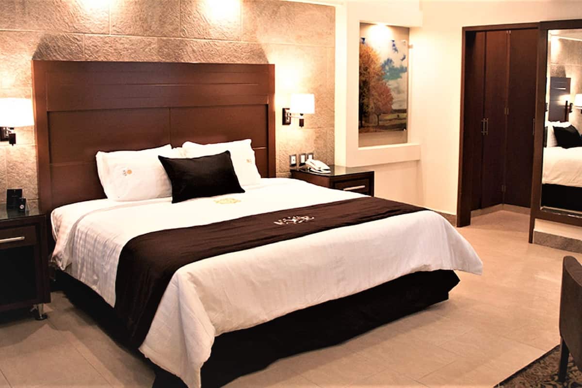 Luxe beddengoed, een minibar met enkele gratis items