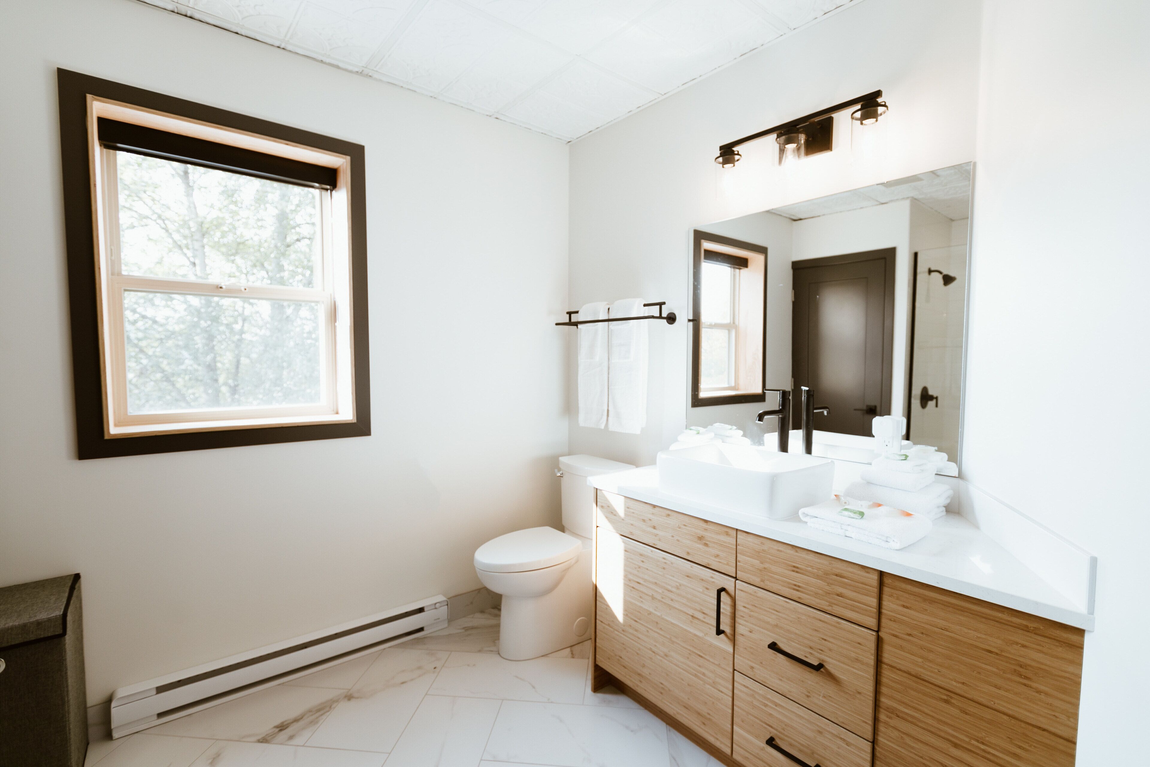 deluxe room, 1 king bed with sofa bed | bathroom | shower, free toiletries, hair dryer, towels