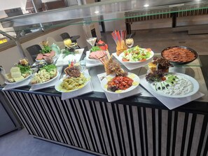 A buffet with various dishes, including salads, meats, and desserts. - Costa Bitezhan Hotel (Bodrum)