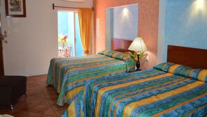 A hotel room with two beds, a window with curtains, a lamp, and a framed picture on the wall. - Hotel La Rienda Misión Tequillan (Tequila)