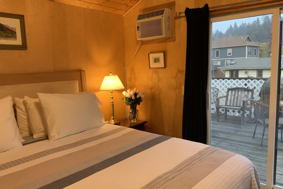 deluxe cabin, 1 king bed | living area | 20-inch tv with cable channels