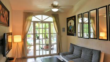Comfort Villa, 2 Bedrooms, Pool View | Living area | 40-inch flat-screen TV with satellite channels, TV