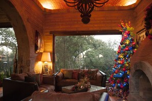 Executive Suite, 1 King Bed, Garden View, Courtyard Area | Living area | Flat-screen TV, fireplace