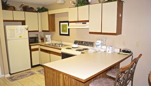 Full-size fridge, microwave, stovetop, coffee/tea maker