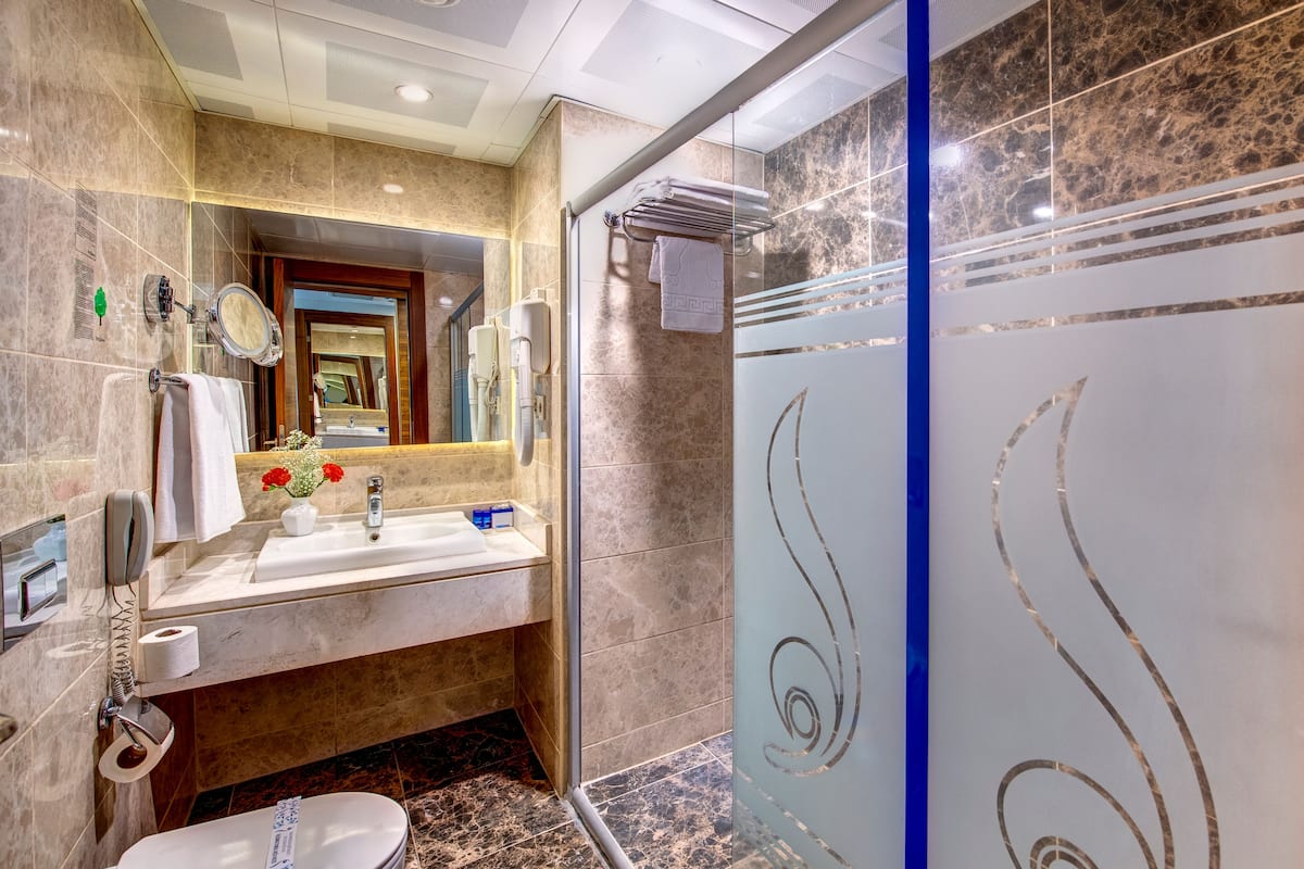deluxe suit | bathroom | free toiletries, hair dryer, bathrobes, slippers