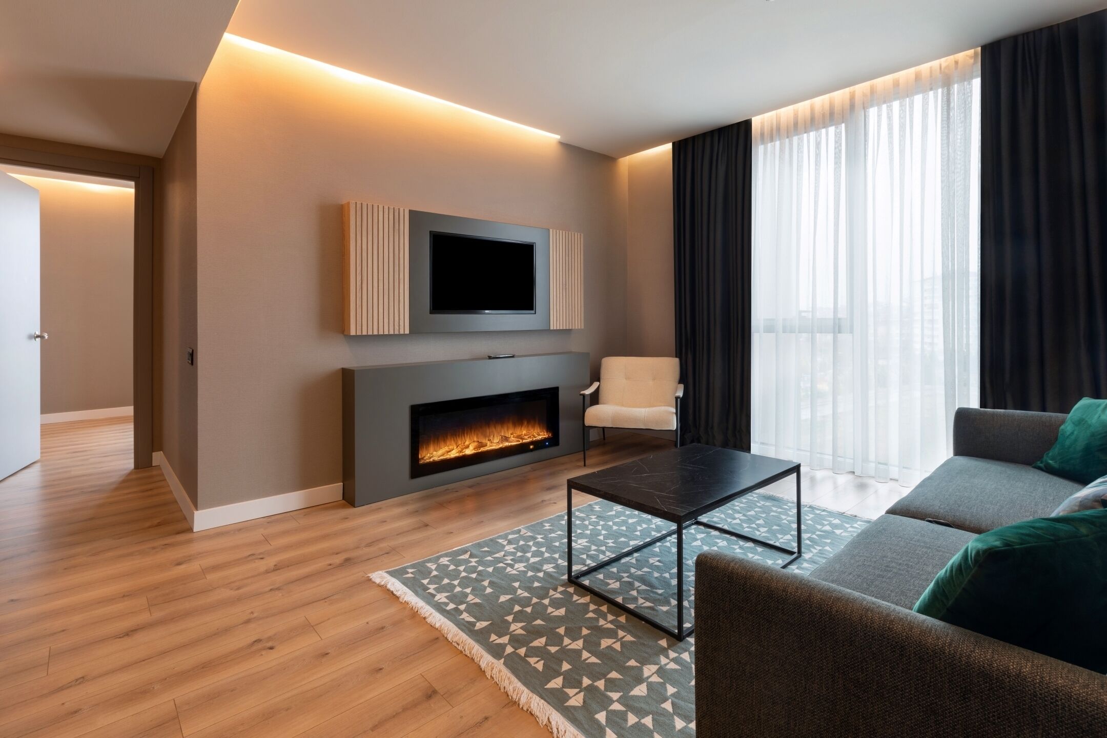 deluxe suite room | living area | 40-inch led tv with satellite channels, tv