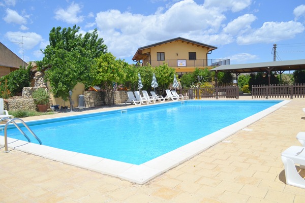 Seasonal outdoor pool, open 10:00 AM to 1:00 PM, pool umbrellas