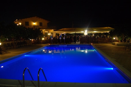 Seasonal outdoor pool, open 10:00 AM to 1:00 PM, pool umbrellas
