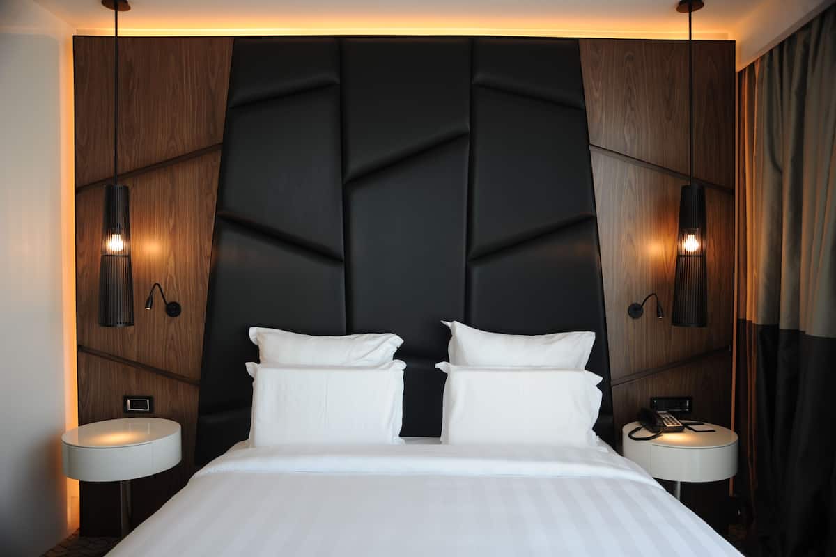 Deluxe Suite, City View | Down comforters, minibar, in-room safe, desk