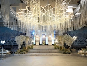 A grand entrance with a chandelier, steps leading up to a building, and a snow-covered landscape in the background. - Pullman Istanbul Airport and Convention Center Hotel (Istanbul)